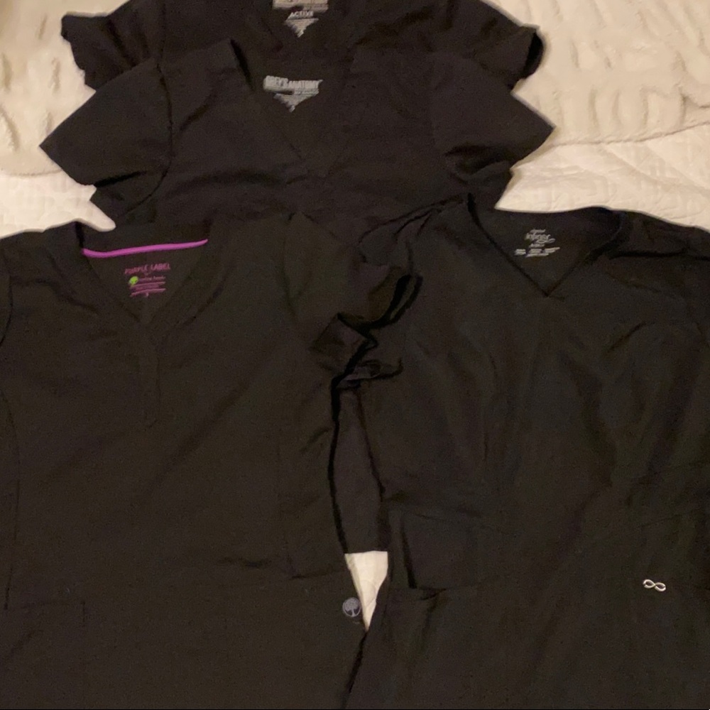 Black scrubs size small. 4 tops and 4 bottoms. Gently used.